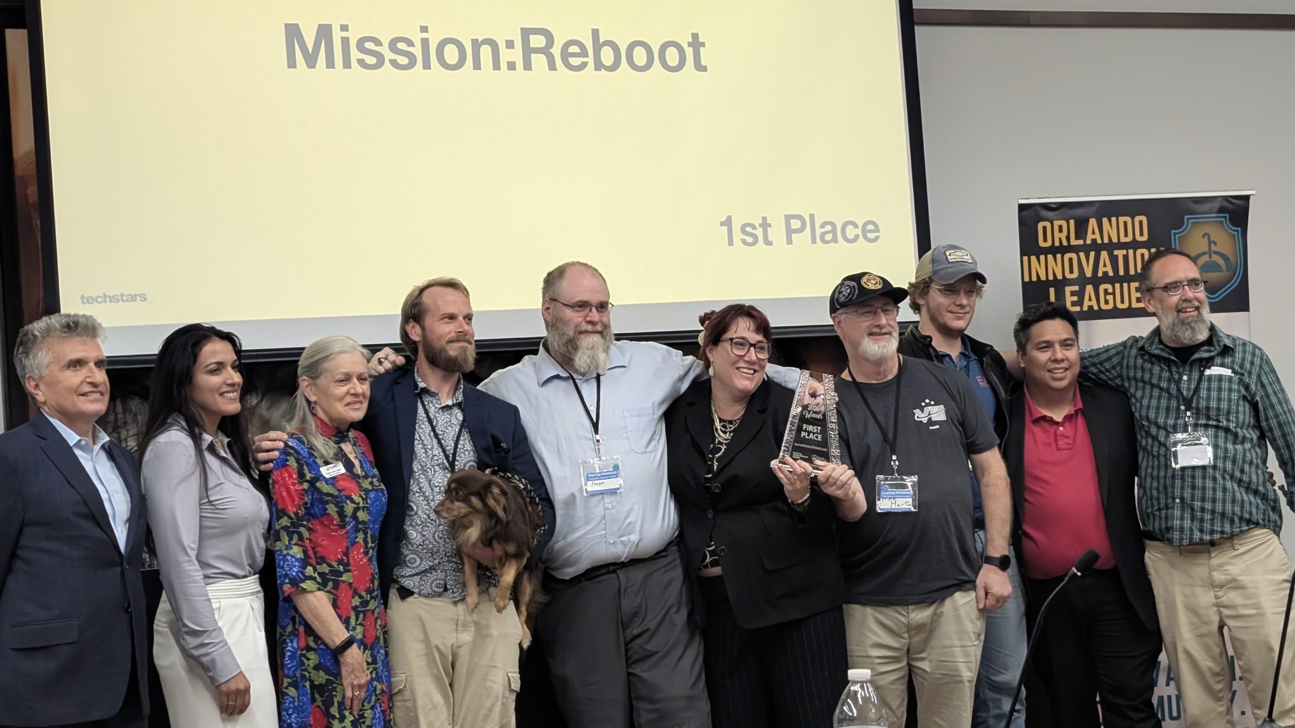 The Mission Reboot team accepting 1st place at Techstars Startup Weekend Orlando, 2026